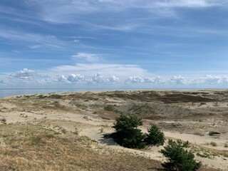 Beautiful dunes with seascape background, perfect surface of the sea
