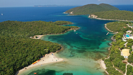 Naklejka premium Aerial drone photo of limestone tropical exotic island bay with crystal clear turquoise sea visited by yachts and sail boats in popular paradise destination