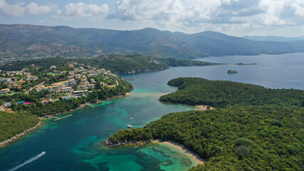 Obraz premium Aerial drone photo of iconic Sivota complex islands consisting of Mourtos island, Mourtemeno and Agios Nikolaos with turquoise clear sandy beaches and popular resorts, Thesprotia, Epirus, Greece