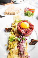 Tasty Steak tartare (Raw beef) - classic steak tartare on white plate