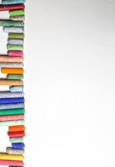 chalks in a variety of colors arranged on a white background