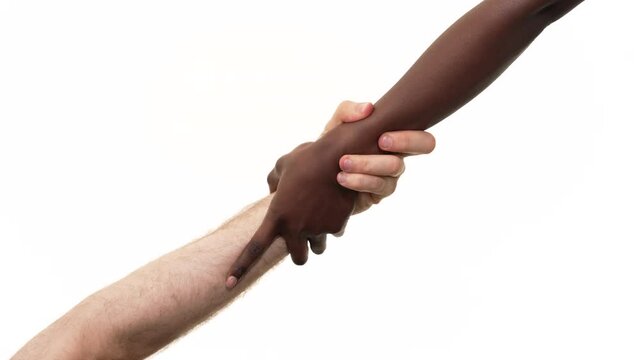 Close up of a black woman giving a helping hand to a caucasian man hand. Isolated on a white background.