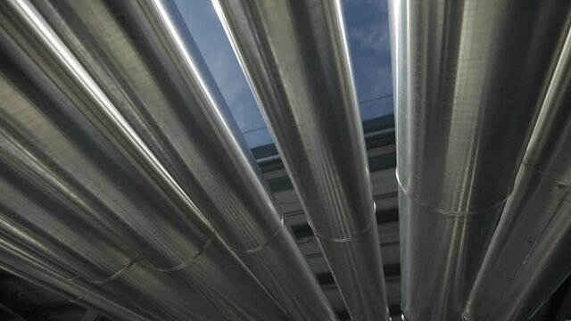Pipes on a roof of a shopping center in Rome. Technical area in a moderne architecture of a shopping centre.