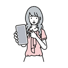 立ってスマートフォンを指差してこちらに向けて見せているオフィスカジュアルの女性