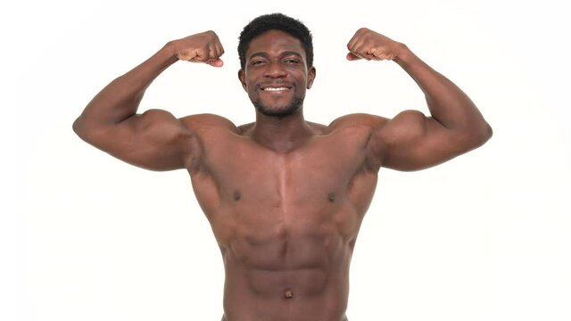 Portrait of an african man flexing his big biceps. Isolated on a white background.