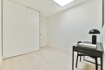 Modern room interior with desk against closet at home