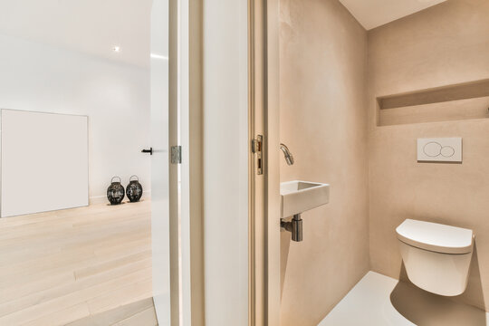 Bathroom interior with open door in modern house