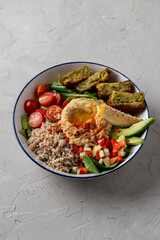 Hummus buddha bowls with quinoa and hard boiled egg, vegetarian restaurant menu, modern simple concept