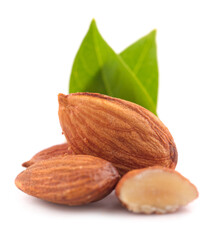 Group of almonds with leaves isolated on white background