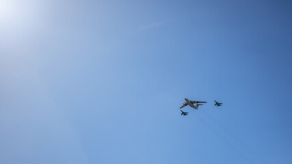 Fototapeta na wymiar Big plane and two fighters