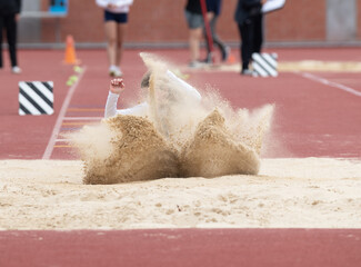 Long jumpers competing at a track and field meet