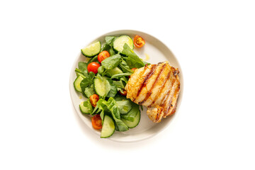 Healthy food, low carb diet. Grilled chicken meat and fresh salad in a plate, isolated on white, top view