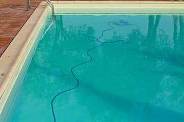 A blue cable inside a swimming pool (Umbria, Italy, Europe) - 460114541