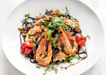 black squid ink spaghetti pasta with shrimp and mixed vegetables