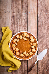 Pumpkin Pie. Tart with whipped cream and cinnamon on rustic background. Traditional american homemade pumpkin cake for Thanksgiving or Halloween Ready to eat. Mock up.