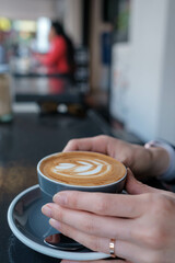 person holding a cup of coffee
