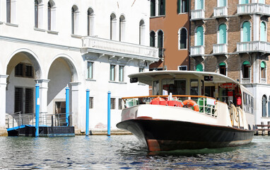 vaporetto the public transport of the island of venice in the grand canal with very few people due to the lockdown - obrazy, fototapety, plakaty