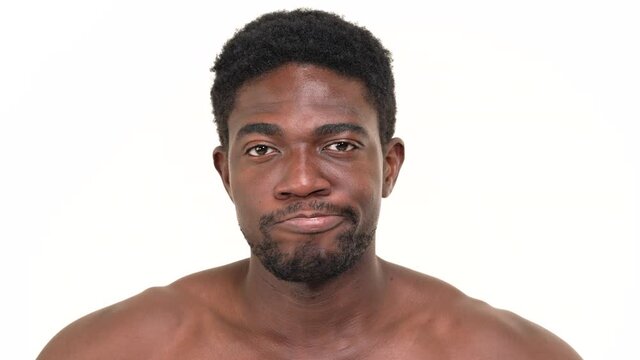 Portrait of a black man whimpering. Isolated on a white background.