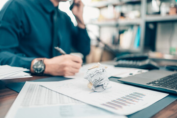 Crumpled papers on office desk. Business strain feeling was frustrated with working failed. fail, conflict, fale and problem working concept. © Charnchai saeheng