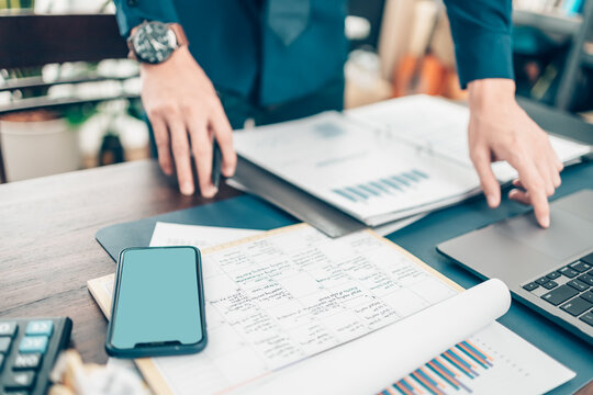 A man hand planning daily appointment and note at office desk. Planner plan Schedule Calendar and reminder. Business planning appointment concept.