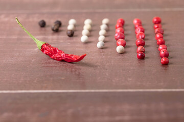 A kind of hot pepper that lies on the table. Spices and seasonings laid out on the table
