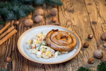 Traditional Christmas food in Czech Republic - white sausage with potato salad
