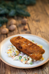 Traditional Christmas dinner in Czech Republic - carp fillet with potato salad