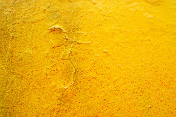 Bright old painted wall with destroyed plaster. Grungy background with cracks, chips and other irregularities. Copy space