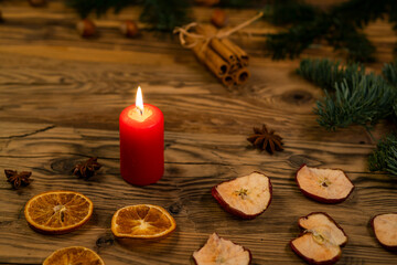 Obraz na płótnie Canvas Traditional Czech Christmas on wood decoration with twig, candle, apple, orange, fruit