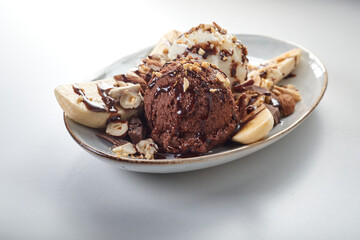 Fototapeta na wymiar Banana split dessert with ice cream scoops