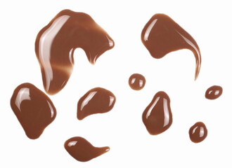 Spilled chocolate milk puddle isolated on white background, top view