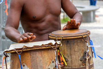 Musician playing atabaque which is a percussion instrument of African origin used in samba, capoeira, umbanda, candomble and various cultural, artistic and religious manifestations in Brazil