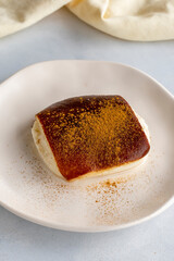 Fried milk dessert on a white background. Turkish dessert kazandibi