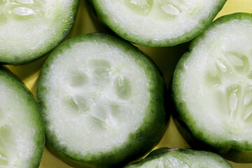 top view close-up cucumber slices background