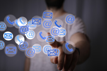 Hand holding using mobile phone with email icon on screen. Concept of business communication