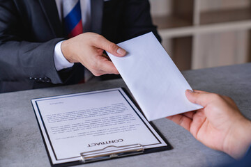 Businessmen or politicians agree to accept bribes given in envelopes. To do illegal business, corruption in the contracting business, corruption concept and bribery.
