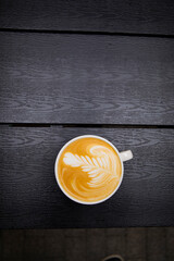 cup of coffee on wooden table