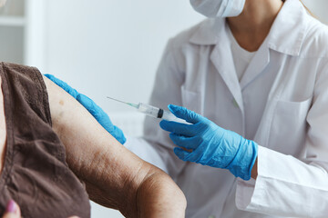 nurse shoulder injection covid-19 passport close-up