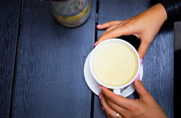 person holding a cup of coffee