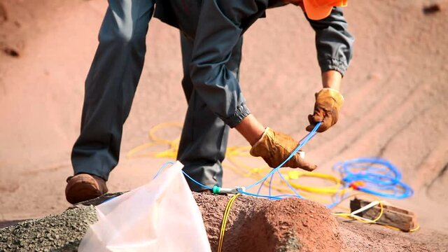 Explosives work in a quarry. The process of placing explosives in an iron ore quarry.