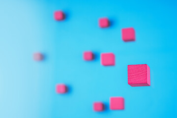 Red cubes on blue background.