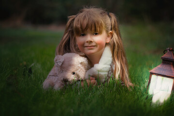 Cute little girl cuddling her teddy bear