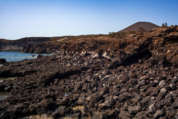View of the scenic lava rock cliff  in the Linosa island.