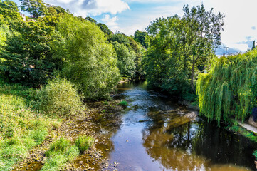 Fototapeta na wymiar A view along the River Nidd from the town of Knaresborough in Yorkshire, UK in summertime