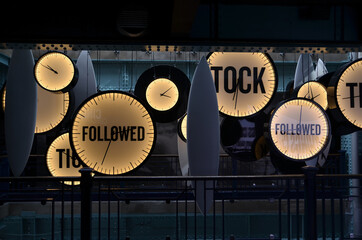 neon clocks with fallowed end  tick tock words background 
