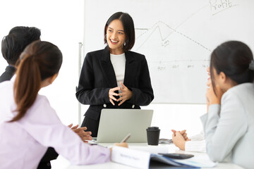 young businesswoman seminar or meeting and presentation about work project on whiteboard