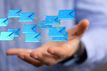 Hand holding using mobile phone with email icon on screen. Concept of business communication