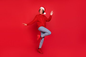 Full body photo of young girl happy positive smile have fun dance holiday isolated over red color background