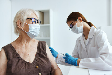 nurse in white coat patient injection vaccine passport