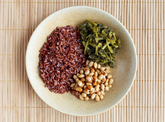 Natto soybeans with rice and pickled vegetables meal top view. Japanese cuisine.